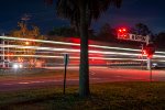 M210 (Baldwin to Cincinnati autoracks) streaks north through Folkston  